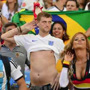 Obrázek 'An England fan mocks a German fan during the World Cup Final'