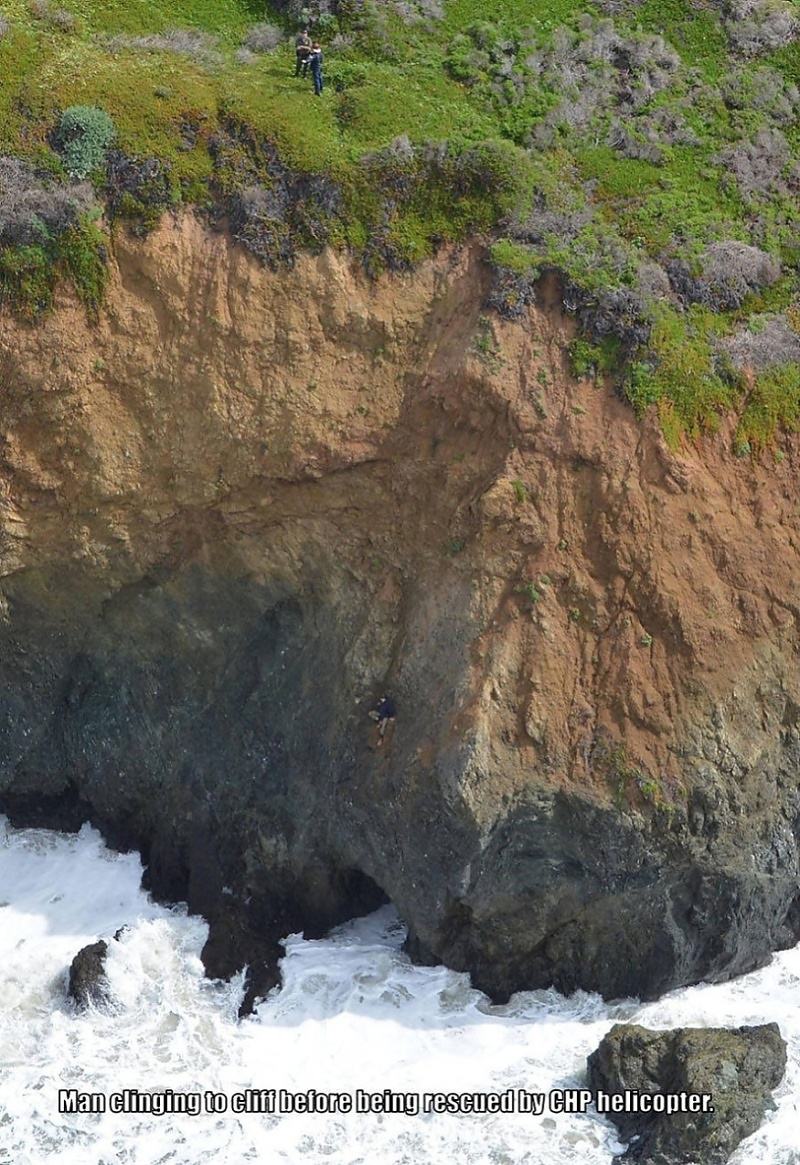 Obrázek man-clinging-to-cliff